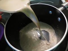 Adding almond milk.